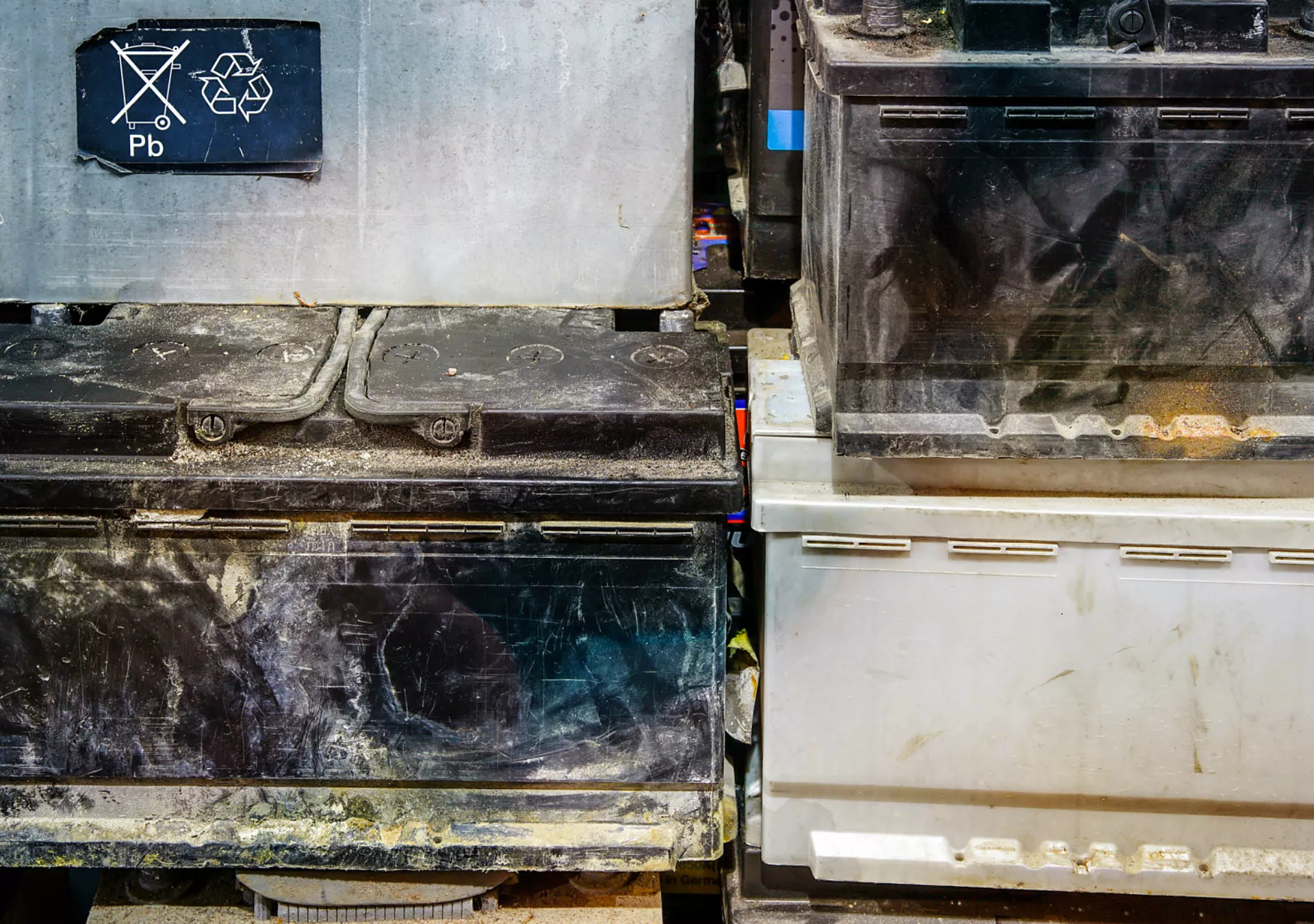 A pallet with used car batteries awaiting recycling