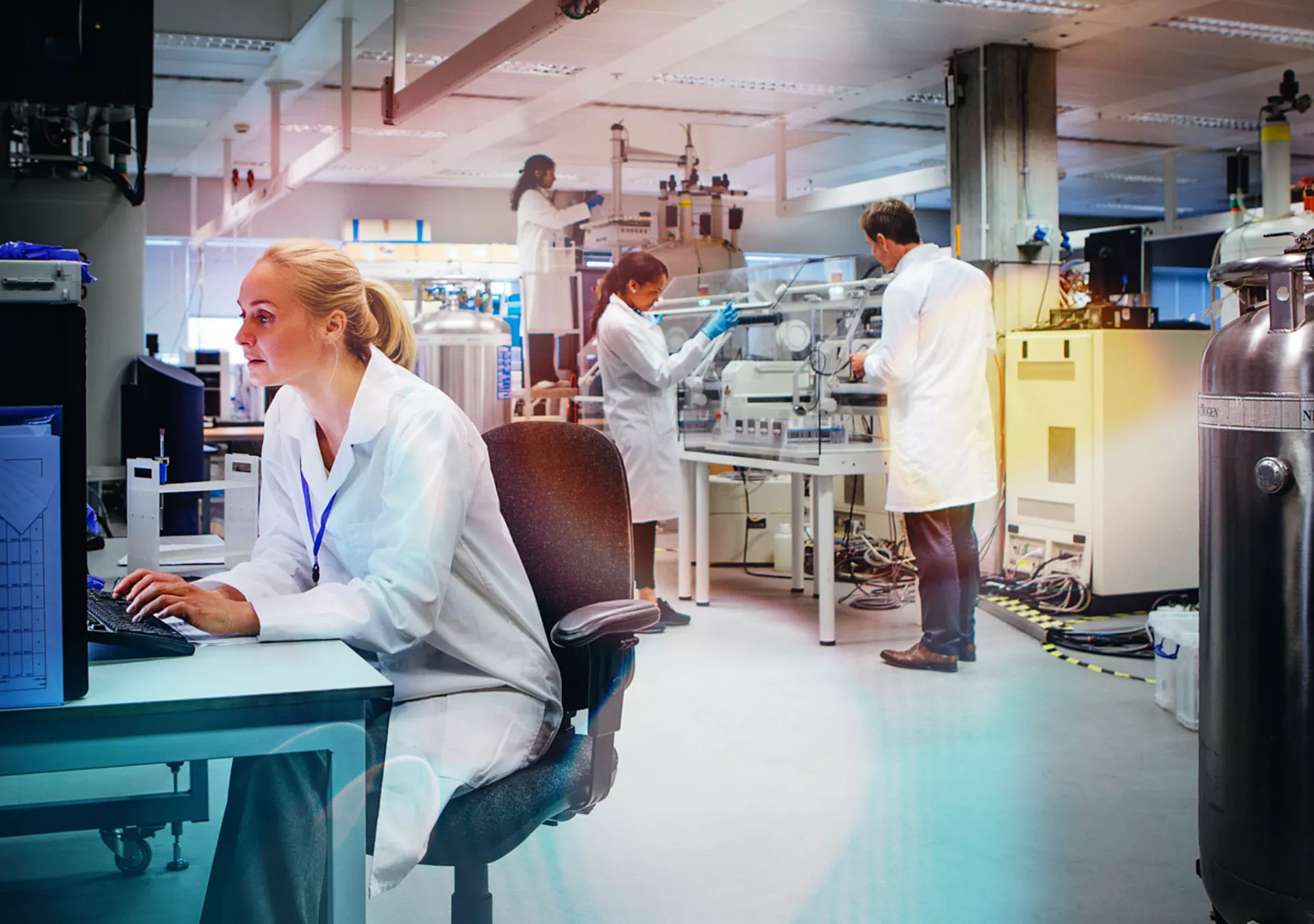 Group of medical science professionals working in a laboratory.