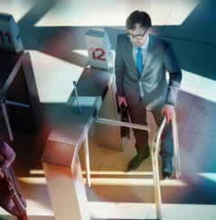 business people passing turnstile on the way to work