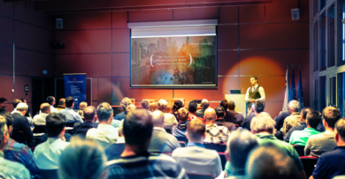Speaker giving a talk in conference hall at business meeting event.