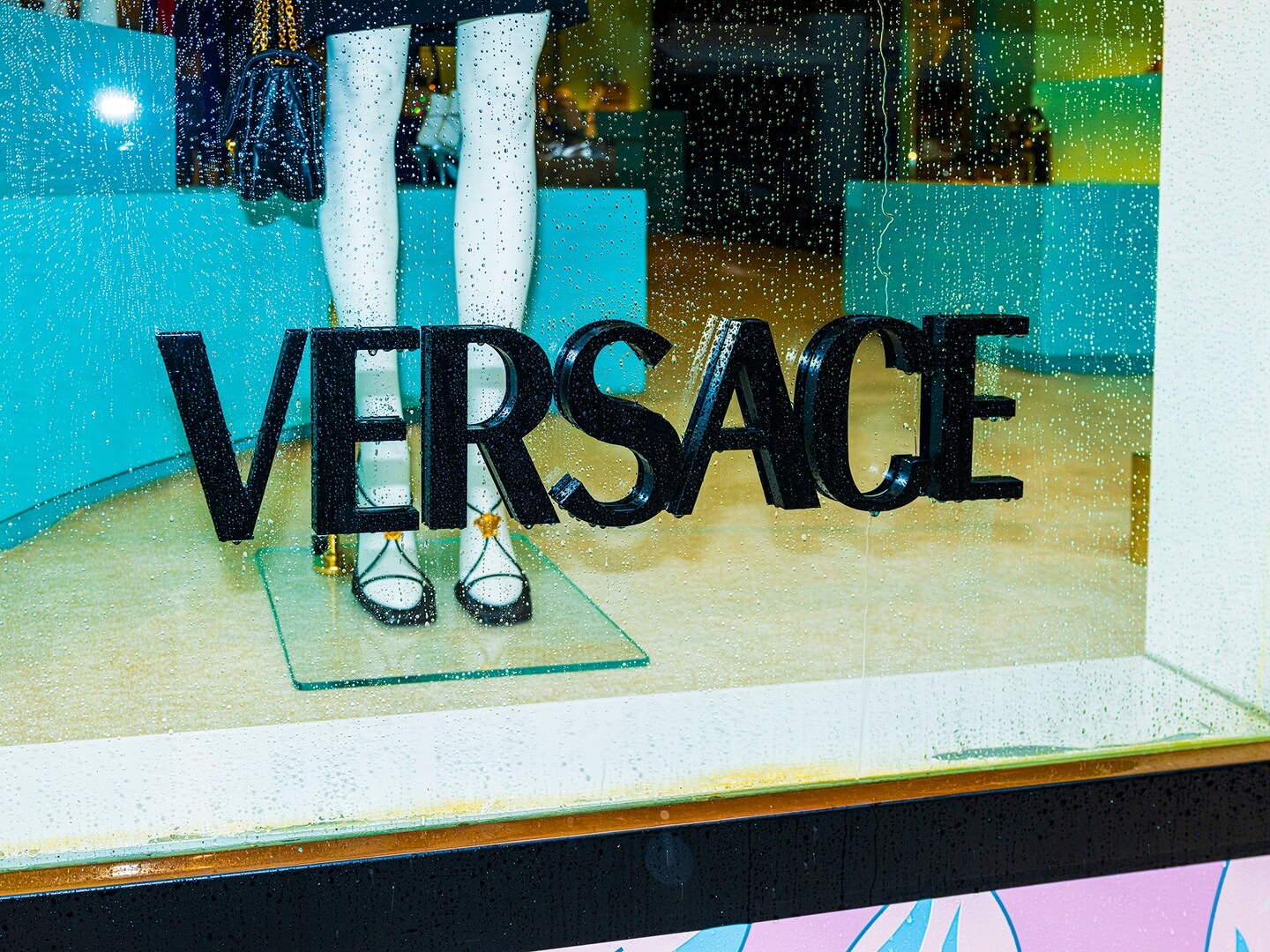 Prada completes purchase of Versace, its longtime rival
