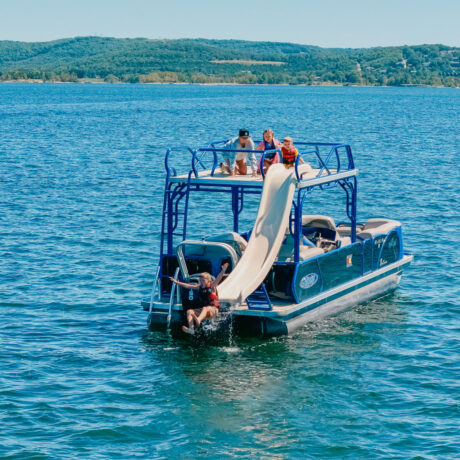 Guests enjoy the waterslide and swim beside State Park Marina’s Aloha pontoon on Table Rock Lake.
