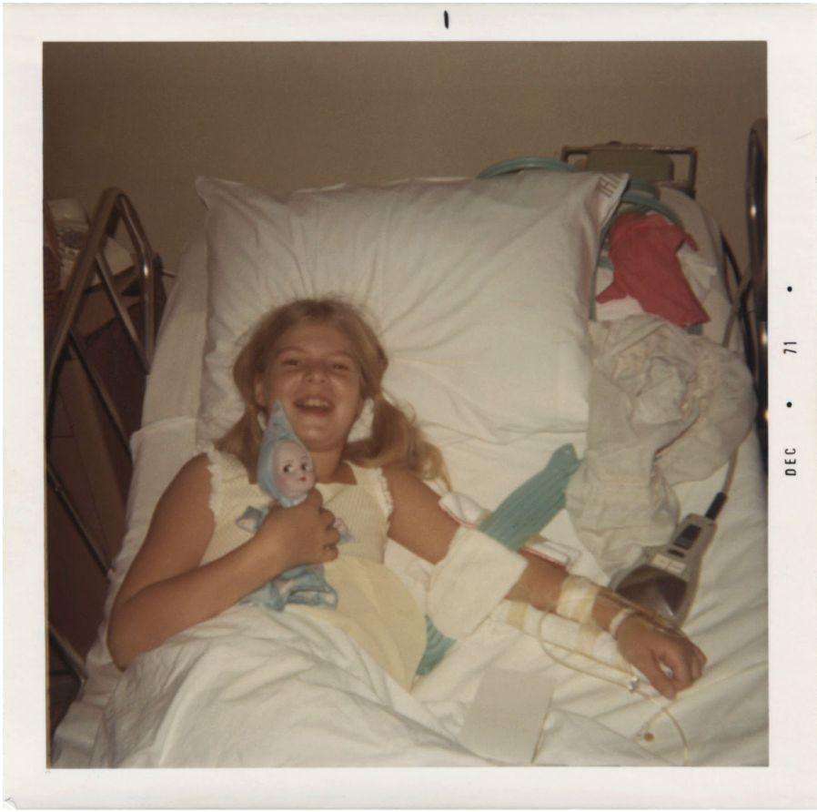 Tammy as a child in a hospital bed