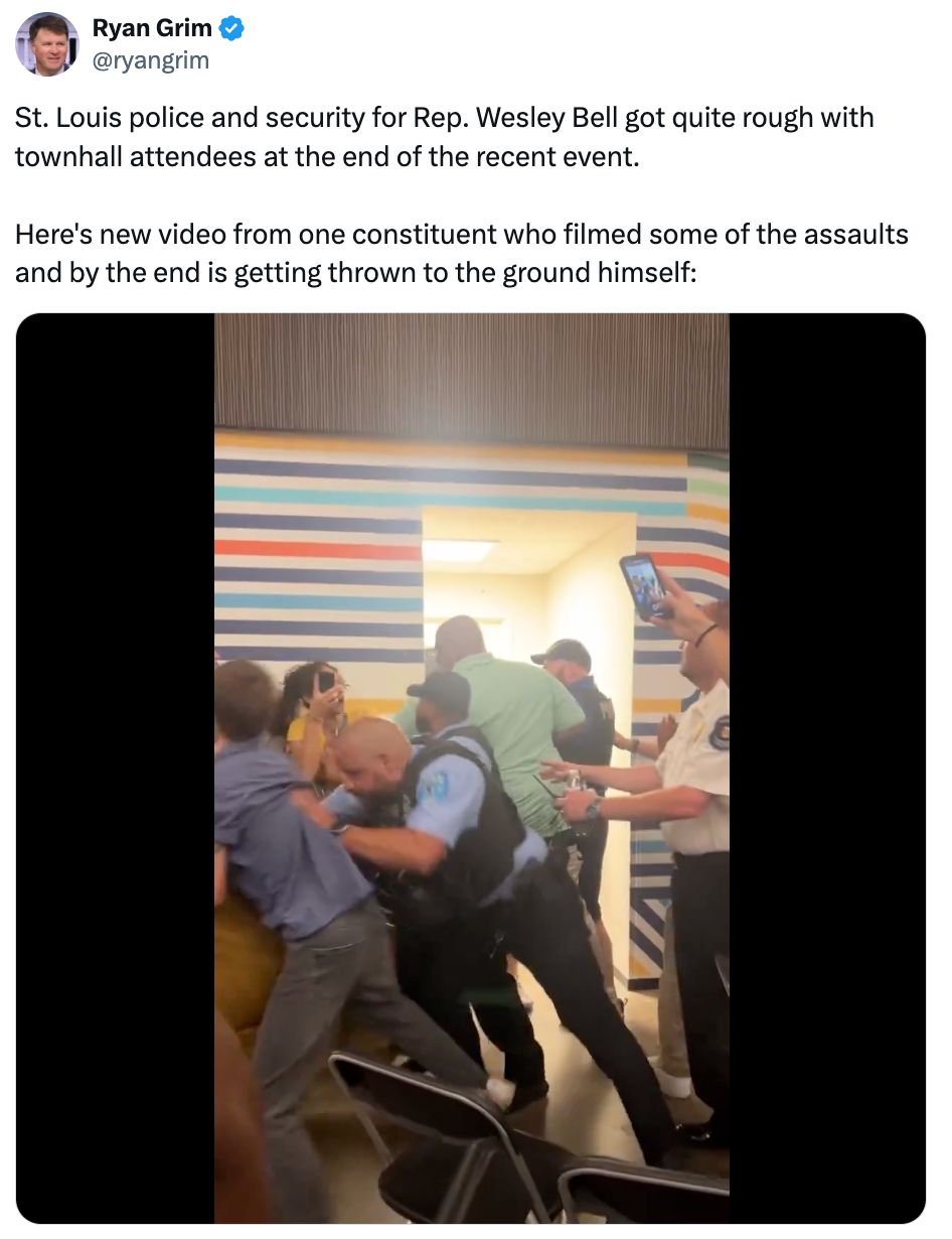 A post on X from Ryan Grim (@ryangrim) reading: 'St. Louis police and security for Rep. Wesley Bell got quite rough with townhall attendees at the end of the recent event. Here's new video from one constituent who filmed some of the assaults and by the end is getting thrown to the ground himself:'. It includes a screenshot of a uniformed security officer shoving protesters.