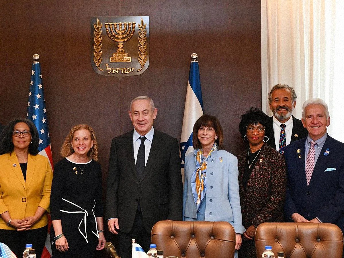 Photo of Rep. Valerie Foushee with other U.S. representatives posing with Benjamin Netanyahu