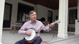 Gif of Senator John Hickenlooper playing the banjo