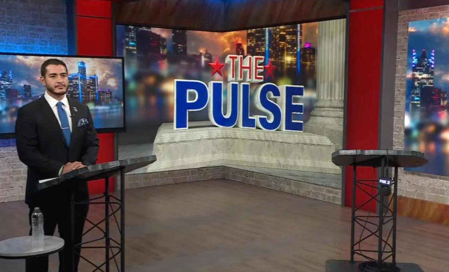 Image of Abdul El-Sayed on the debate stage alone.