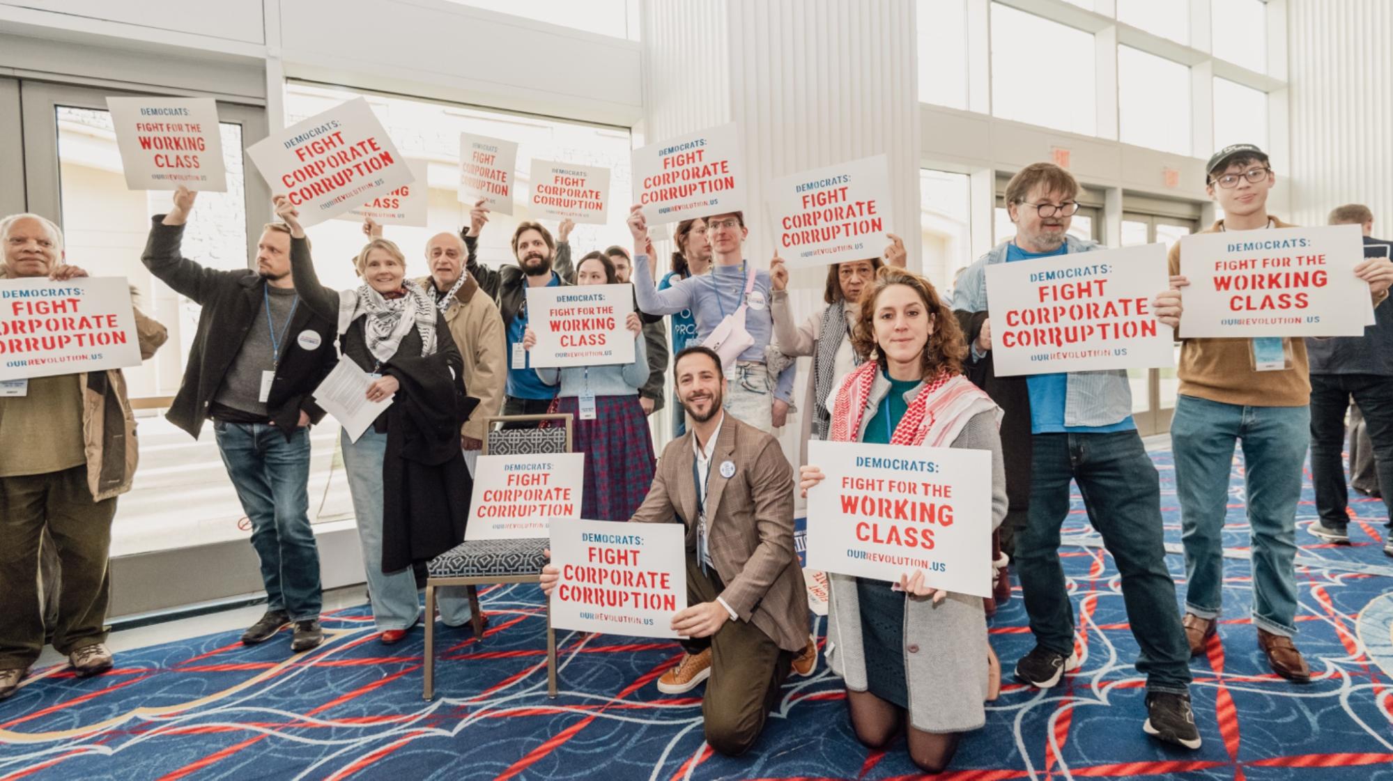 Our Revolution protesters at a DNC Committee meeting