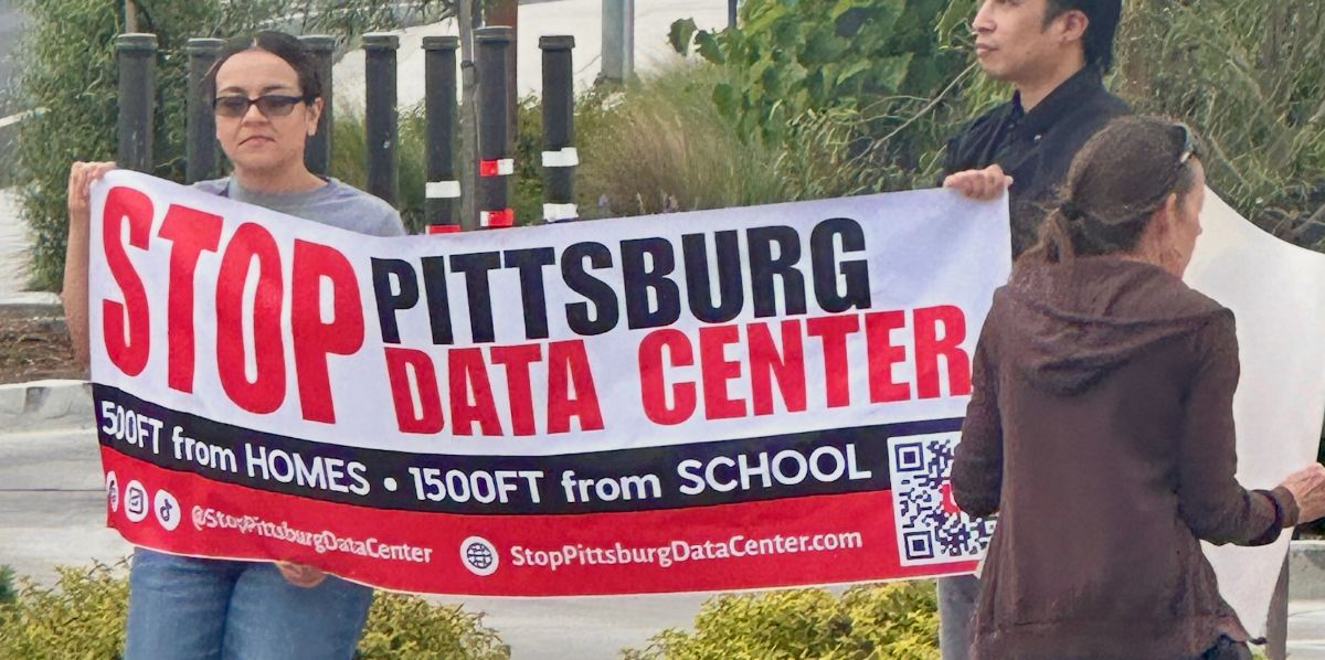 Photo of protestors holding a banner that reads STOP PITTSBURG DATA CENTER