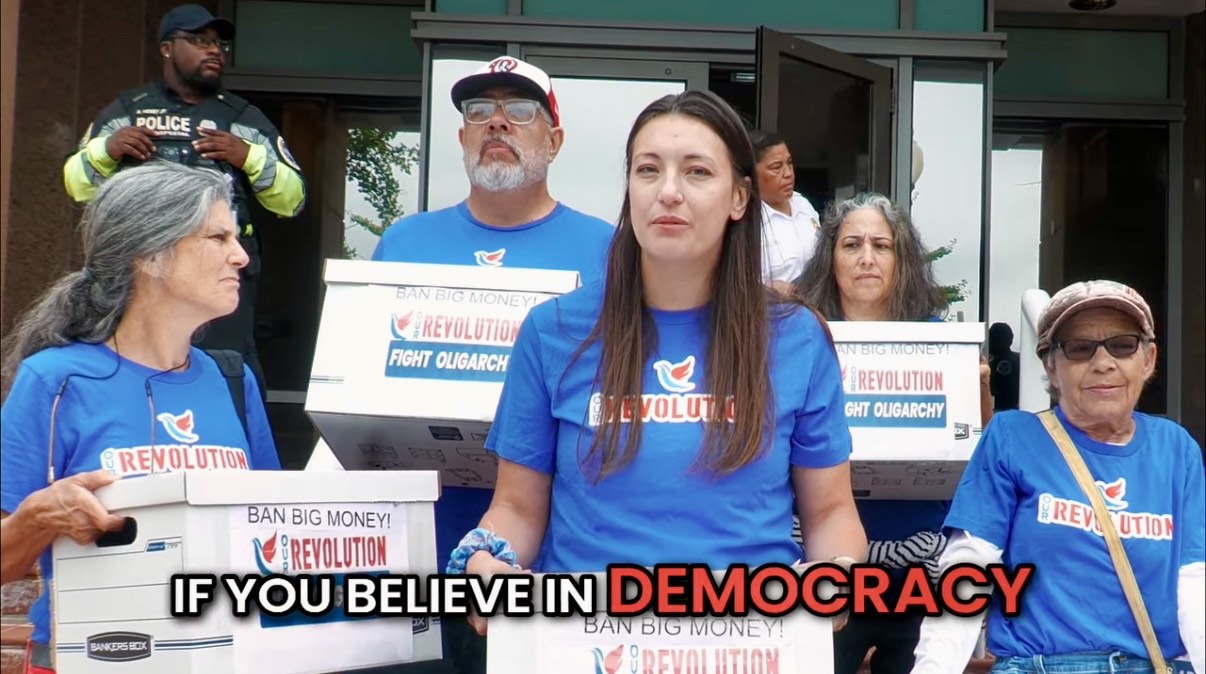 Photo of Our Revolution activists delivering petition signatures