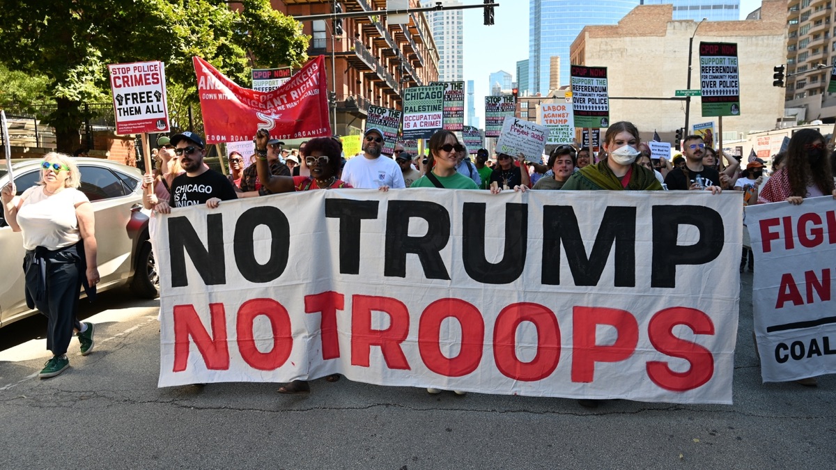 Headline: No Trump No Troops protest photo