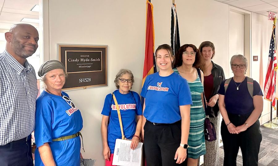 A photo of a group of Our Revolution members and supporters standing in a Senate office hallway outside Sen. Cindy Hyde-Smith’s office.