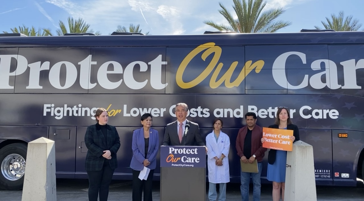 Photo of Rob speaking at the Protect Our Care event