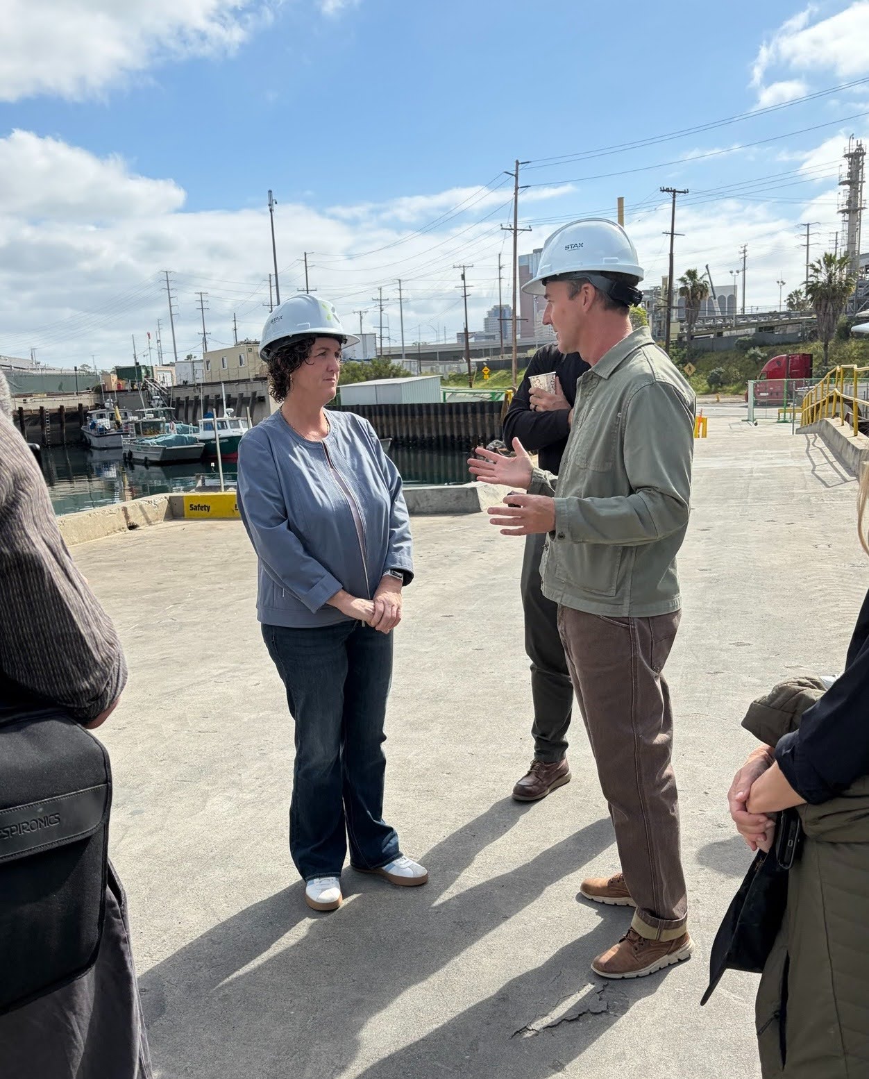 Edward Norton and Katie Porter standing next to each other.
