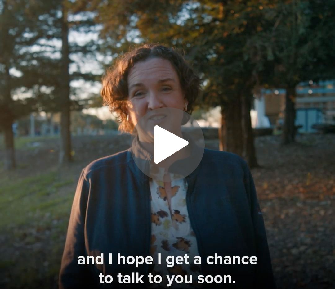 A screenshot of from a video. Katie Porter is looking into the camera with a caption reading 'and I hope I get a chance to talk to you soon.' A play button is over the center of the image.