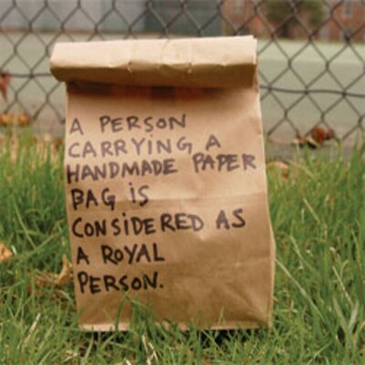 Bats & Mice - A Person Carrying A Handmade Paper Bag..