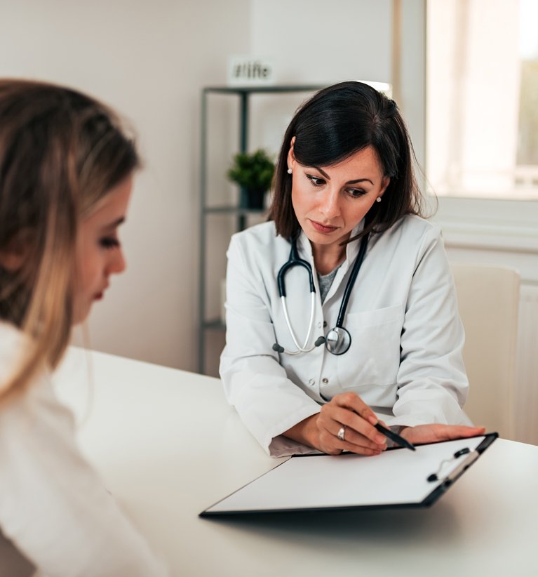 Doctor diagnosing patient based on signs and symptoms