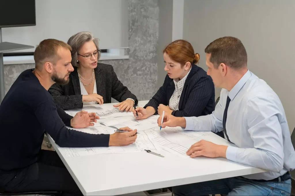 Team discussing project plans at a meeting table