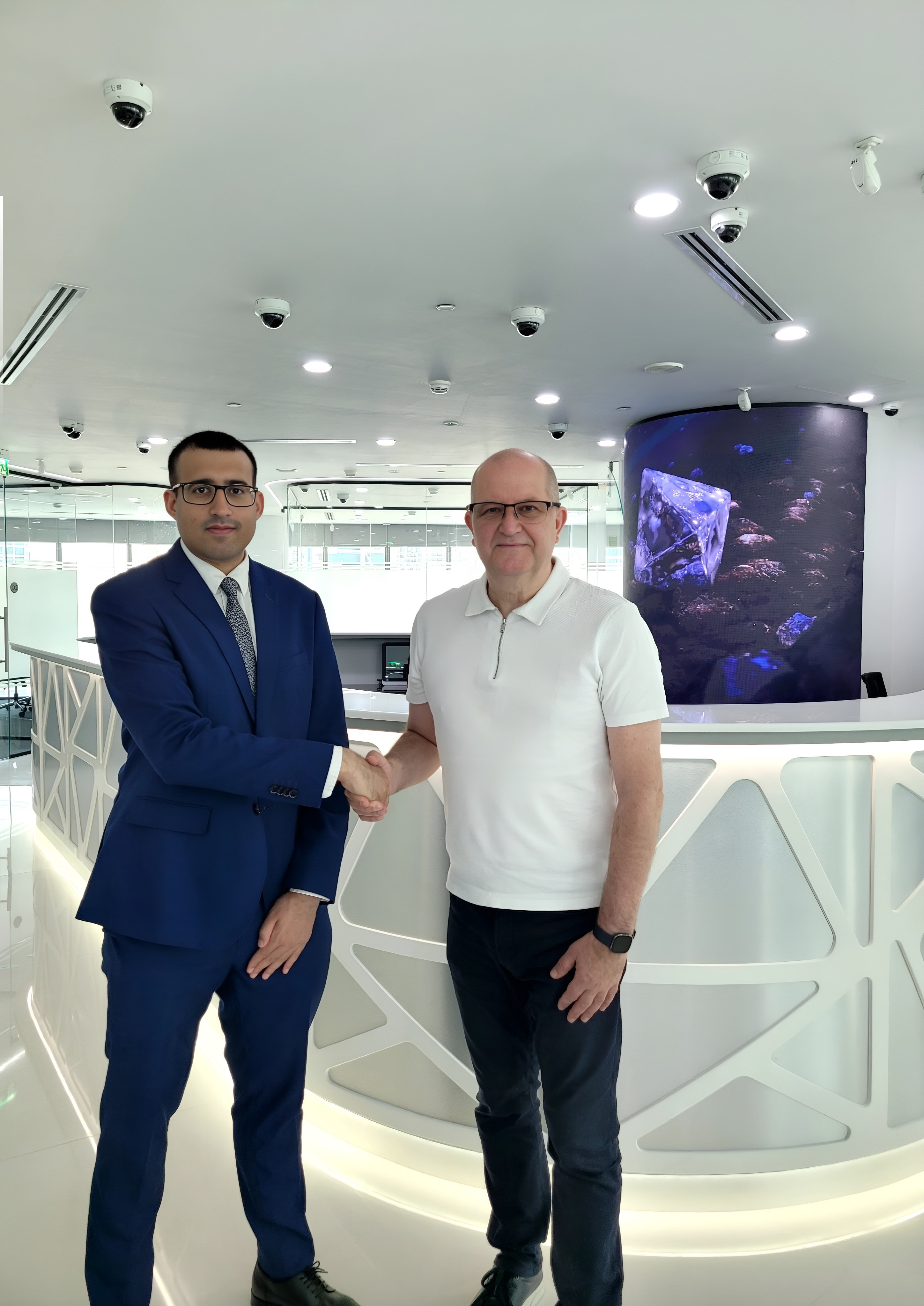me shaking hands with my mentor, Mr. Paul Duncombe, COO of Trans Atlantic Gem Sales, a leading global company specializing in the sales and tenders of rough and polished diamonds, including rare and exceptional stones such as pinks.