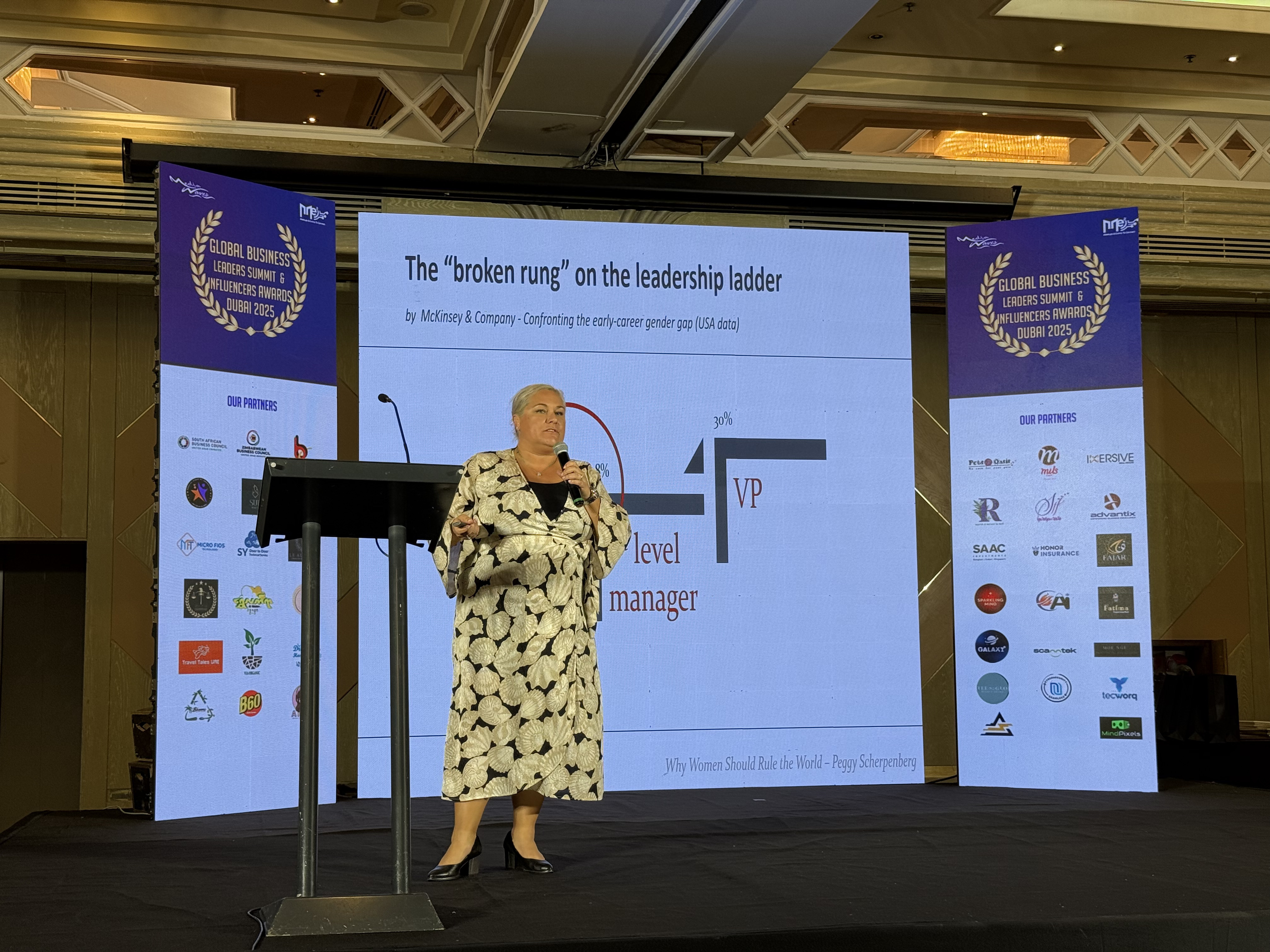 Peggy Scherpenberg giving a keynote speech on Women in Leadership