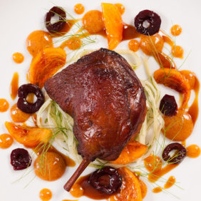 Five spice duck legs with warm pickled fennel cherries and persimmons