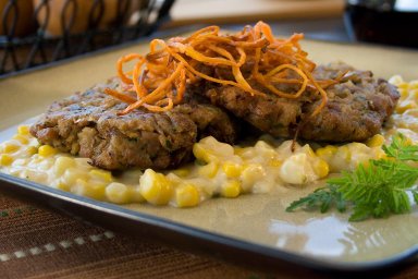 Duck cakes with bourbon creamed corn