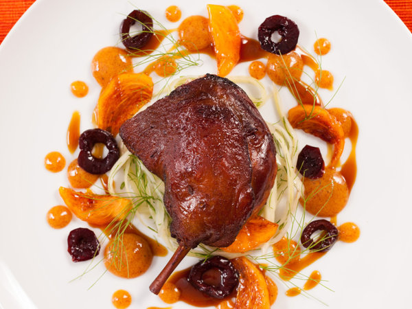 Five spice duck legs with warm pickled fennel cherries and persimmons