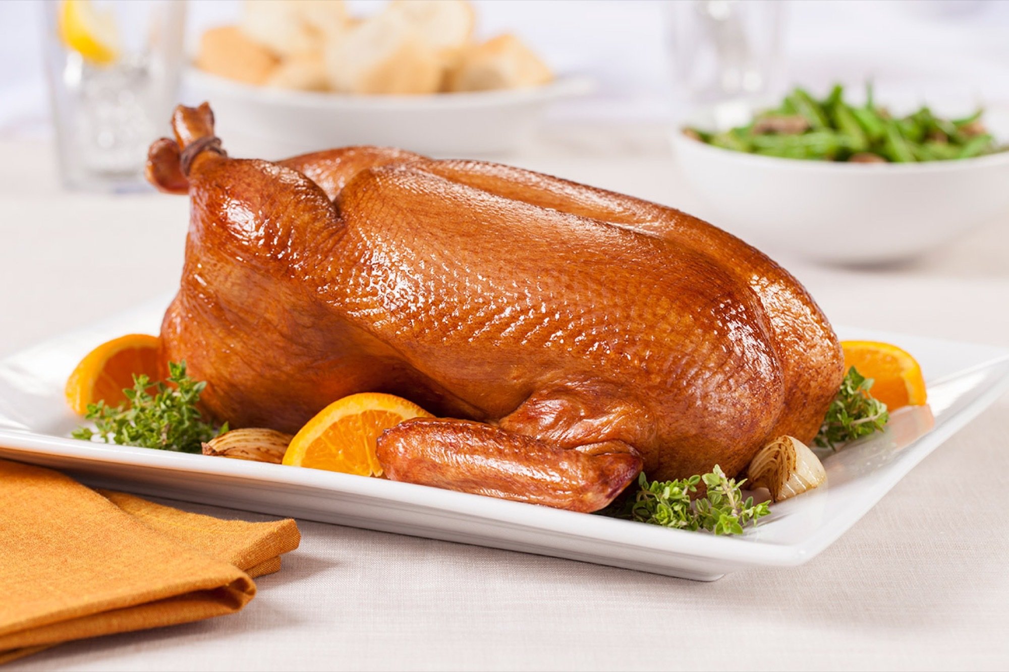 Whole duck plated with oranges