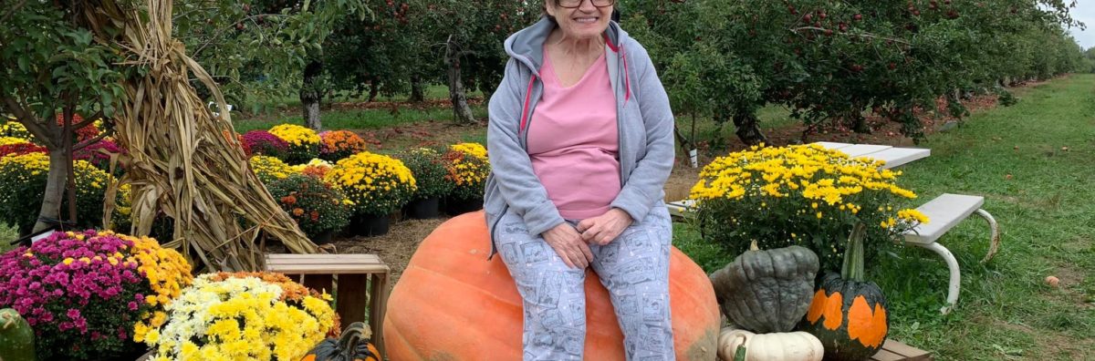 Marci on a pumpkin
