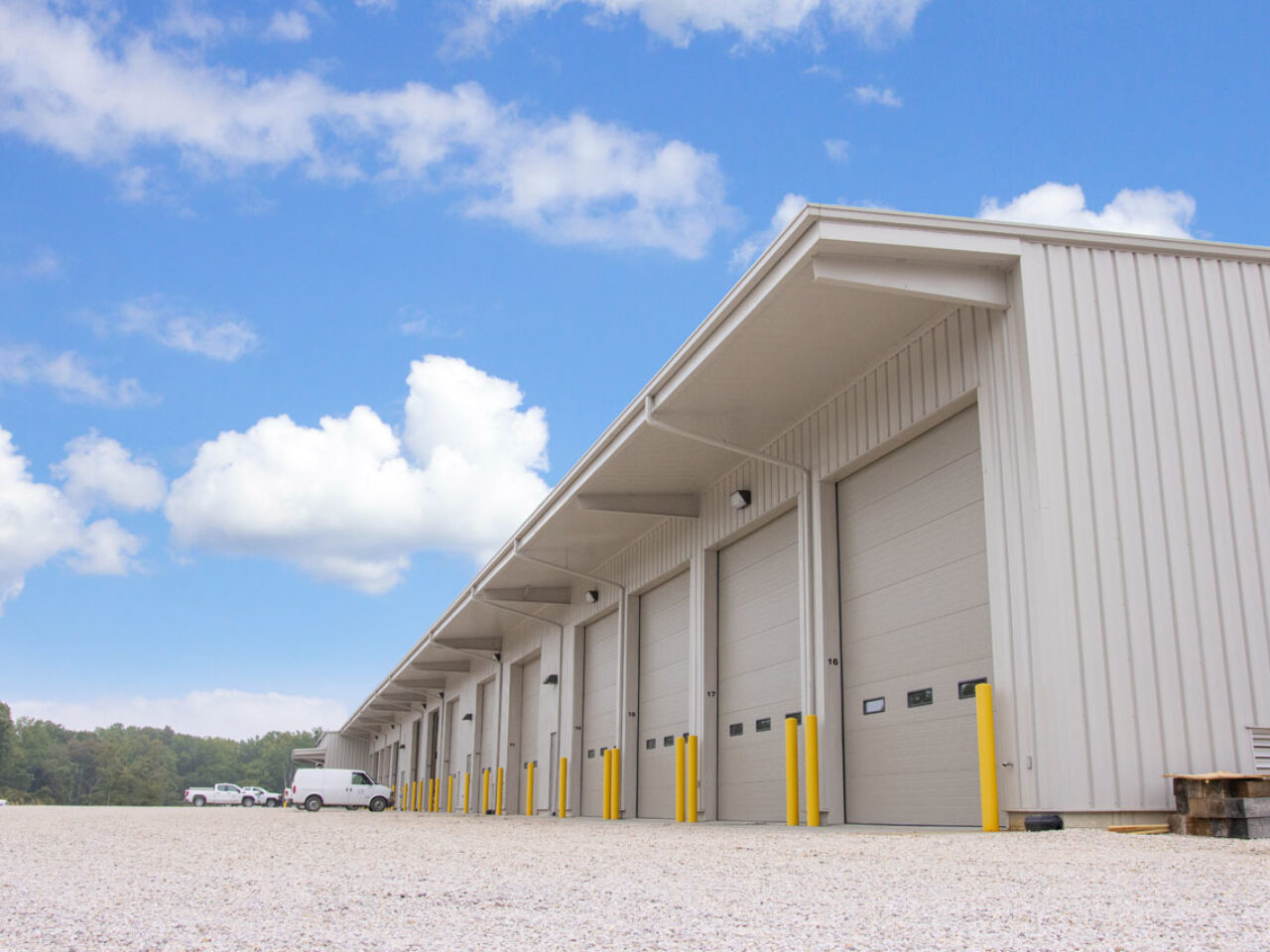 Pre-engineered metal building with steel exterior and commercial overhead doors, designed for fire resistance and long-term insurance durability.