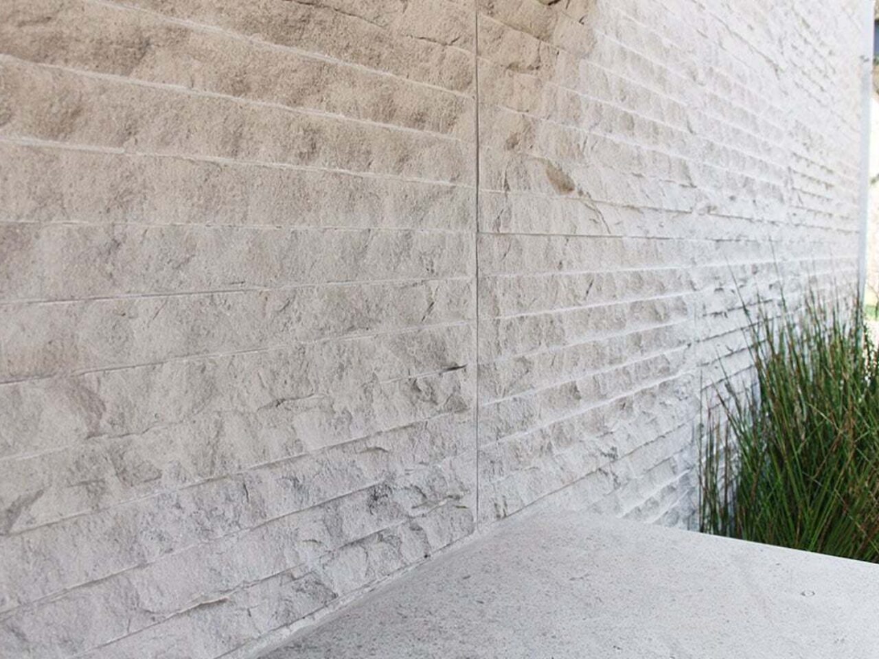 Block wall with stucco texture.