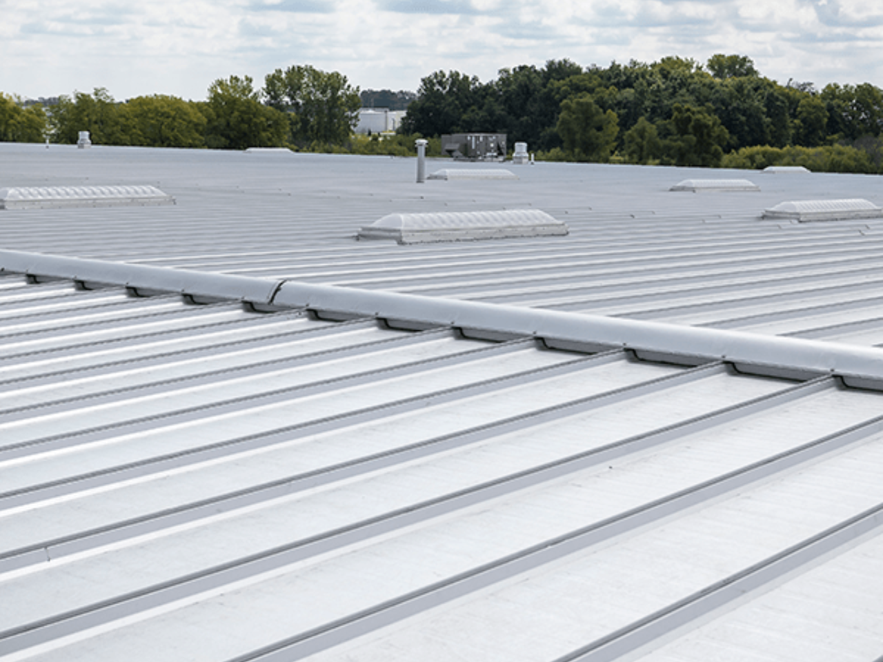 Overhead view of a Butler MR-24 metal roof system on a commercial building.