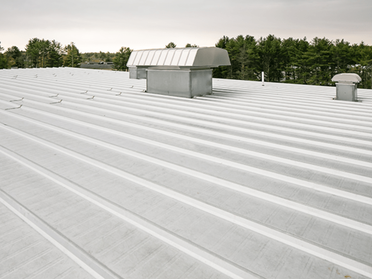 Overhead view of a Butler MR-24 metal roof system on a commercial building.