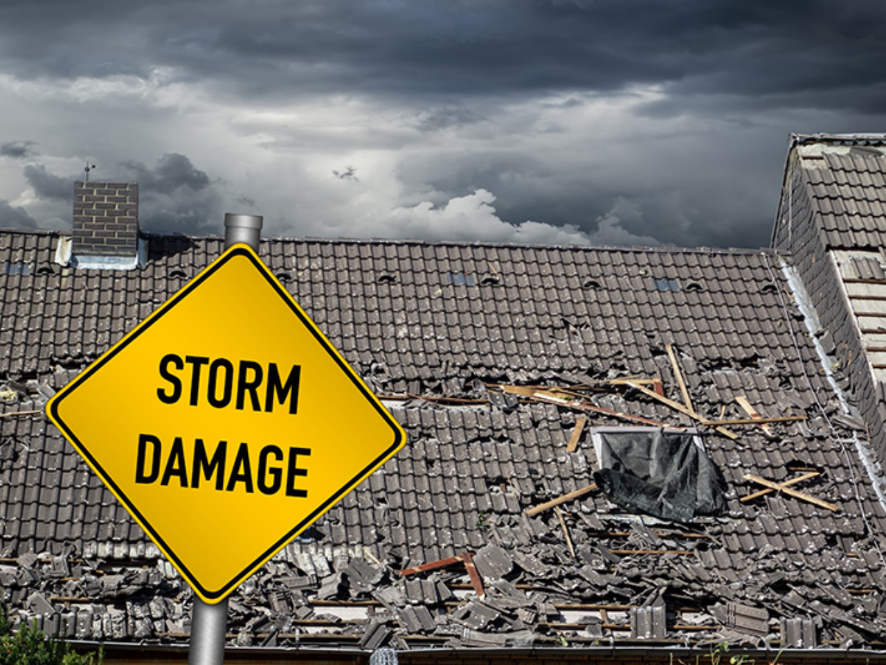 Storm damage to a commercial roof in the Midwest with warning sign under dark storm clouds, showing why storm preparedness matters for Indiana buildings.