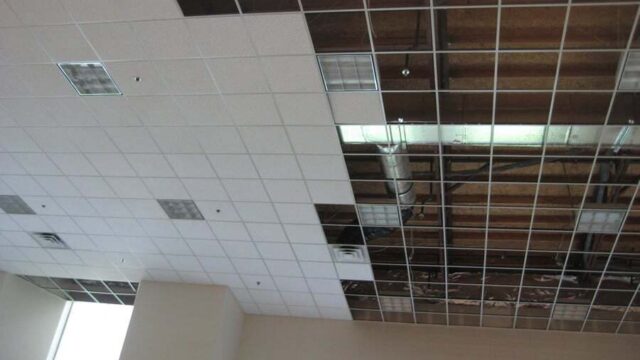 Installed suspended ceiling grid and acoustic tiles in a Southern Indiana commercial office.