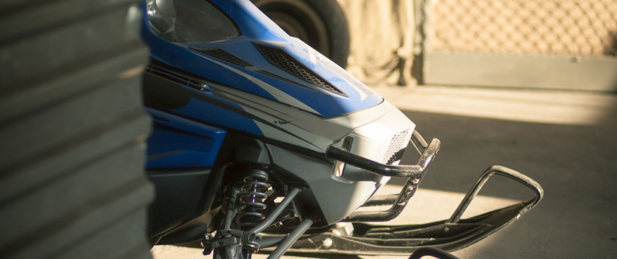 A snowmobile sitting in storage