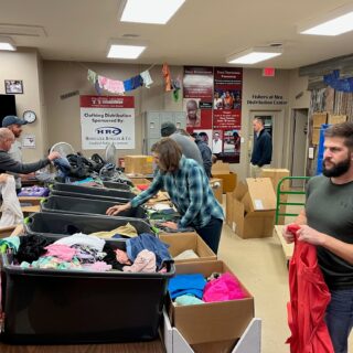 The ROP Shop Employees sorting clothing for Forgotten Children Worldwide.