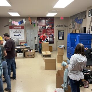 The ROP Shop Employees sorting clothing for Forgotten Children Worldwide.