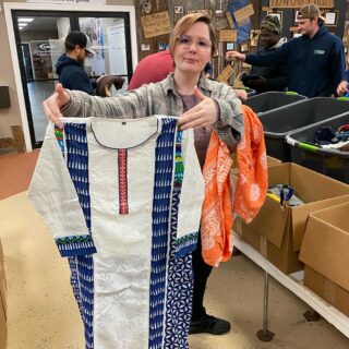 The ROP Shop Employees sorting clothing for Forgotten Children Worldwide.