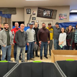The ROP Shop Employees sorting clothing for Forgotten Children Worldwide.