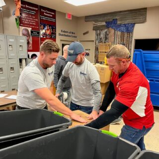 The ROP Shop Employees sorting clothing for Forgotten Children Worldwide.