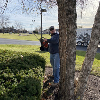 The ROP Shop and OCi volunteering their time to help with grounds keeping at Gateway Woods