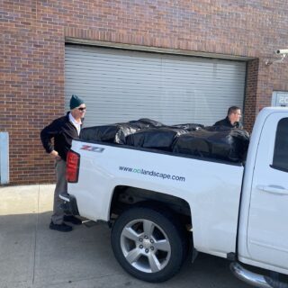 Officers helping unload gifts brought to hand out to inmates for Christmas Behind Bars through the volunteers at The ROP Shop and Outdoor Concepts.