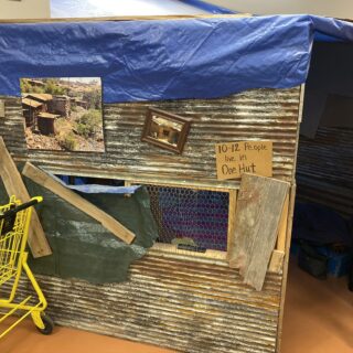 Employees of The ROP Shop and Outdoor Concepts sort and pack clothing to be shipped out by Forgotten Children Worldwide to needy around the world.