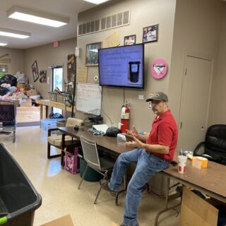 Employees of The ROP Shop and Outdoor Concepts sort and pack clothing to be shipped out by Forgotten Children Worldwide to needy around the world.