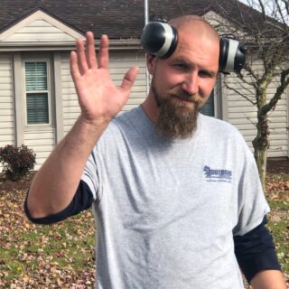 Employees of The ROP Shop and Outdoor Concepts help cleanup the grounds of Gateway Woods, an outreach for people in need.