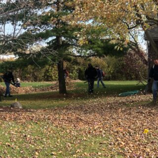 Employees of The ROP Shop and Outdoor Concepts help cleanup the grounds of Gateway Woods, an outreach for people in need.
