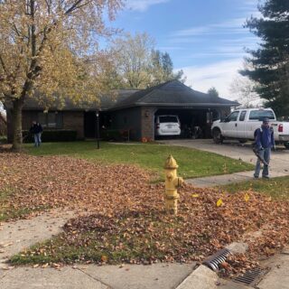 Employees of The ROP Shop and Outdoor Concepts help cleanup the grounds of Gateway Woods, an outreach for people in need.