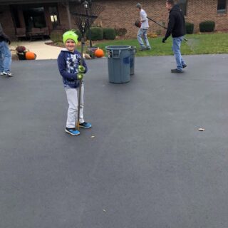 Employees of The ROP Shop and Outdoor Concepts help cleanup the grounds of Gateway Woods, an outreach for people in need.