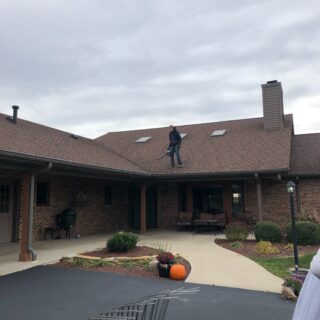 Employees of The ROP Shop and Outdoor Concepts help cleanup the grounds of Gateway Woods, an outreach for people in need.